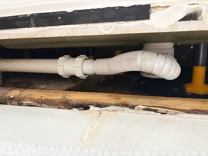 Plumbing pipework repair under a bath
